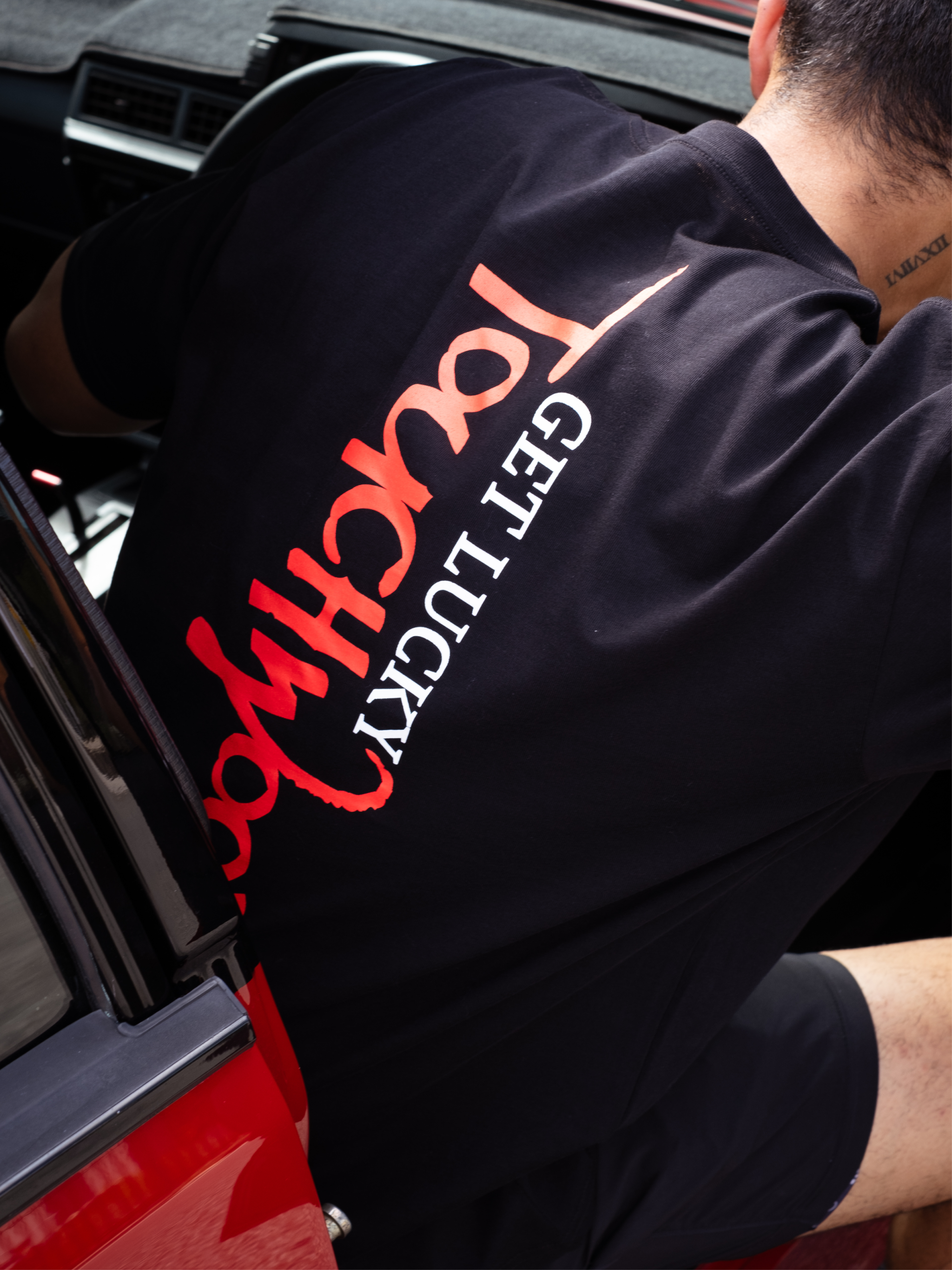 The Get Lucky Centre Logo Tee – Black & Red